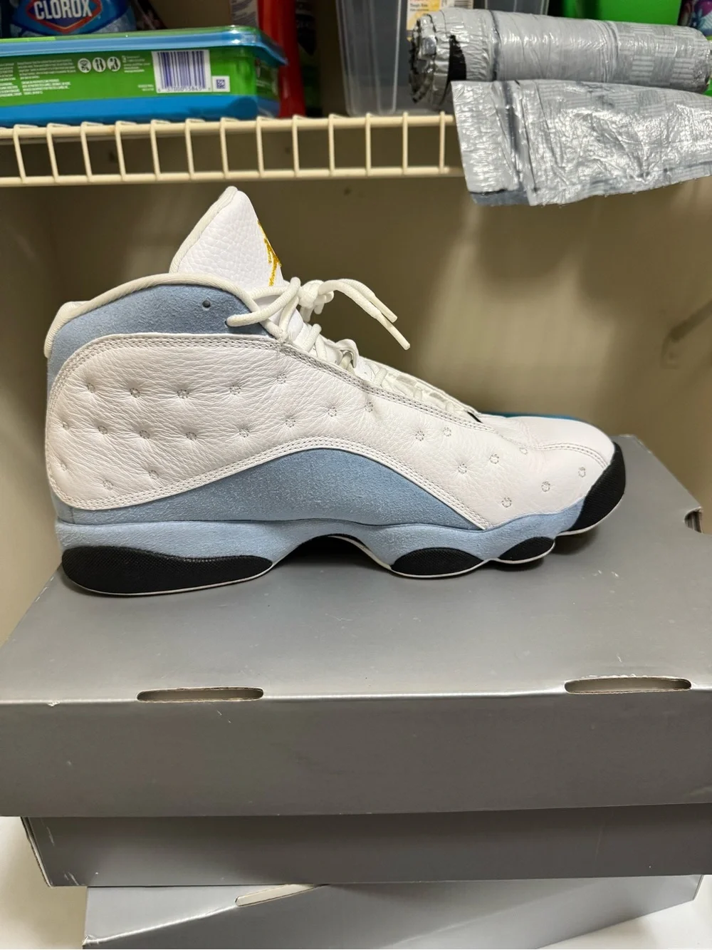 Jordan Men’s White Athletic Shoes with Black and Gold Accents